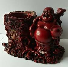 LAUGHING BUDDHA STANDING NEXT TO TREE STUMP WITH GOLD SCRIPT ...