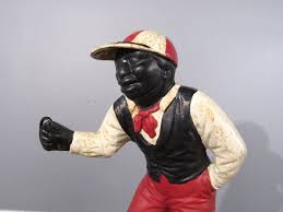 Sold at Auction: Cast Metal Lawn Jockey
