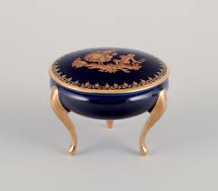 WorldAntique.net - Limoges, France. Five pieces of porcelain consisting of a lidded jar, two vases, a lidded three-foot