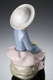 Sold at Auction: Lladro Pretty and Prim 5554 Porcelain Figurine Seated Girl Holding Flowers