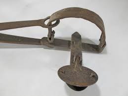 Sold at Auction: Antique cast iron hanging scale & animal trap