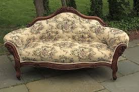 Lot - VICTORIAN SETTEE in walnut with grape carved crest ...