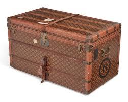 Lot - An Aux Etats Unis leather and canvas steamer trunk ...
