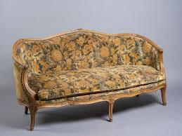 Sold at Auction: MANIFATTURA DEL XVIII-XIX SECOLO , MANIFATTURA DEL XVIII-XIX SECOLO A walnut corbeille sofa in Louis XV style, carved decorations with floral and vegetal motifs, arched legs