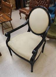 Lot - BLACK LOUIS XVI-STYLE ARMCHAIR