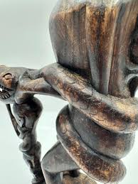 Vintage African Hand Carved Wood Statue | EstateSales.org