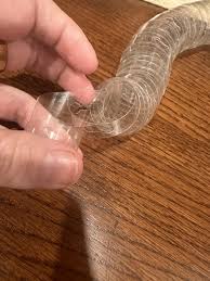 It's a long clear plastic ribbon with these holes in them, found all by itself rolled up in a plastic bag. : r/whatisthisthing