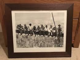 Dark brown picture frame and picture of men sat on girder over New York City. | eBay UK