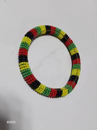 Beaded Bangle bracelets with Trade beads and a hardbound Exotic beads book | EstateSales.org