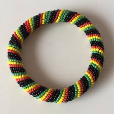 Sold at Auction: Beaded black yellow green and red bangle bracelet