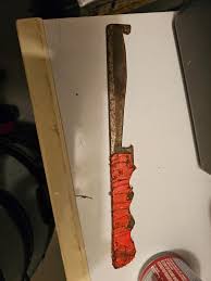 Found this in my an old toolbox. Metal, handle is wrapped in ...