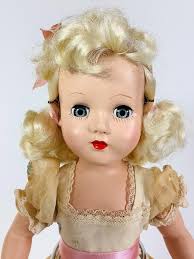 Lot - Effanbee hard plastic "Tintair Doll" in box. 14" all original doll with nylon platinum hair, sleep eyes, closed mouth, on five-piece body. Doll is dressed in embroidered organdy over cotton