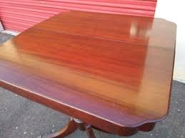 VINTAGE BEAUTIFUL MAHOGANY SHERATON STYLE FLIP TOP/SWIVEL GAME TABLE W/BRASS CLAW FEET. REALLY NICE CONDITION! MADE IN THE USA! for Sale in Phoenix, AZ - OfferUp