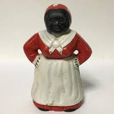 Sold at Auction: Painted Cast Iron Mammy Bank