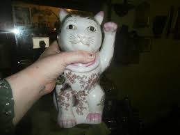 Everyone just had these ceramic cats