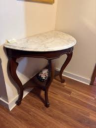 Marble top table ( half round antique Legs)