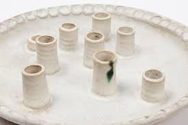 Sold at Auction: McCarty Pottery Menorah Candleplate, Merigold Miss