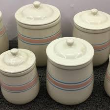 Sold at Auction: 8 Piece Mccoy Pink And Blue Banded Canister Set