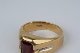 Lot - 14 KARAT YELLOW GOLD, DIAMOND, & GARNET RING