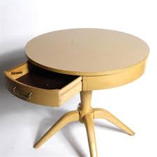 Sold at Auction: Vintage Mid Century Mersman blonde round top side table, marked under top and in drawer, #8179. with round base and four angled feet...