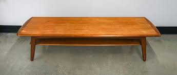 Lot - Danish Mid-Century Modern Teak Two Tier Coffee Table by Svend A. Madsen 16 x 71 1/2 x 21 3/4 in. (40.6 x 181.6 x 55.2 cm.)