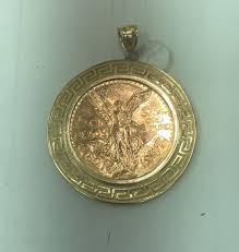 Gold 50 pesos coin medalion 24 k 61.4 g | EstateSales.org