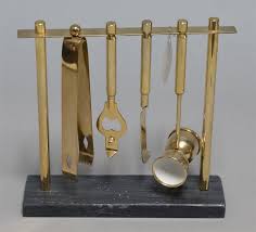 Lot - Brass bar tool set on a marble base