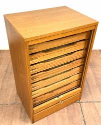 Sold at Auction: 1960s Danish Teak Tambour-Door Cabinet & Key