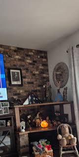 As you can see, I have idea about decorating. It's random stuff put together. I have this shelving, not sure what to do with it. There is a TV to the left