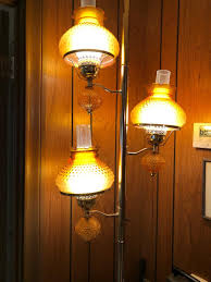 Amber hobnail tension pole lamp | EstateSales.org