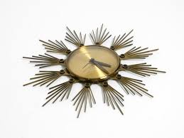 Original 1950s Sunburst wall clock by Atlanta made of brass and battery operated For Sale at 1stDibs