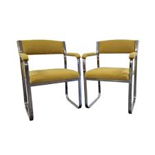 PAIR OF STEEL AND BOUCLE ARMCHAIRS. – NAMA VINTAGE