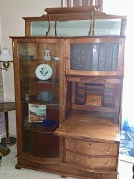 #18 ANTIQUE LARGE DROP FRONT OAK SECRETARY CURVED GLASS DOOR ELEVATED TOP SHELF | EstateSales.org