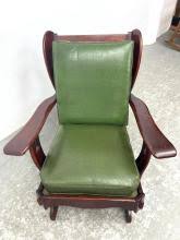 Sold at Auction: DARK WOOD FRAMED ARM ROCKING LOUNGE CHAIR. GREEN UPHOLSTERED CUSHIONS. CUSHMAN STYLE.