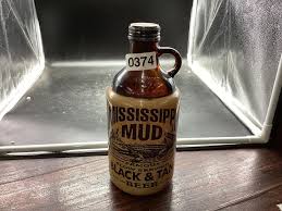 Sold at Auction: MISSISSIPPI MUD BEER BOTTLE