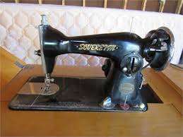 BlindSquirrelAuctions - Vintage Sovereign Sewing Machine In Cabinet