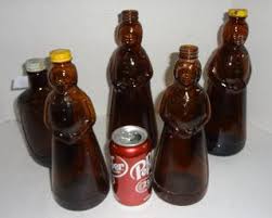 Vintage Brown Glass, Four Aunt Jemima Syrup Bottles, Two Large, Two Small, Two With Original Caps, One Log Cabin Bicentennial, 9 - 12"T, Good Condition Auction | 1BID