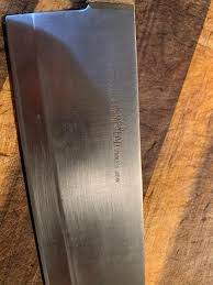 My dad started to cut an onion with a bread knife! searching through his drawers I find this big beauty but it's so dull you couldn't even cut water. Would sharpening it
