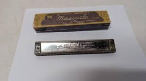Sold at Auction: Vintage Butterfly Harmonica - Occupied Japan