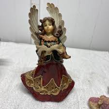 3 Angels … One With Harp, One Holding Book And One Holding ...