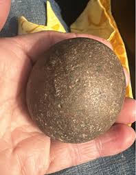 This rock was found in Madison County Illinois. It appears almost round. I have no idea what it is help. ￼ | Facebook