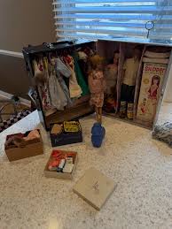 Anyone know anything about the old Barbie's ? I have a ...