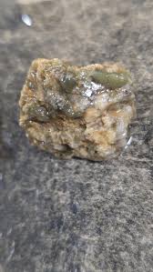Anyone know what the green rock is in this pebble? I'm ...