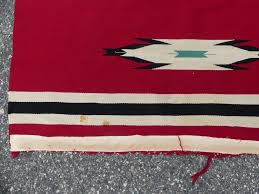 Sold at Auction: OLD INDIGO RED NAVAJO RUG