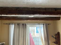 Historic home features decorative barn beams in Clinton's Ditch