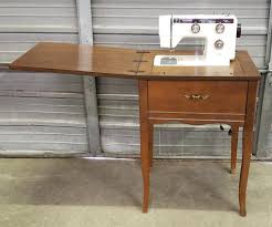 Sold at Auction: RICCAR MODEL 707 SEWING MACHINE W/ CABINET