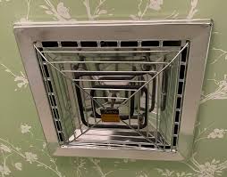 Non-functional heated vent fan with unique heat coil design