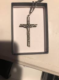 i was wondering if anyone could tell me how to prevent this cross necklace from discoloring further, it's my grandfathers and ever since i started wearing it the back has started to
