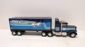 Sold at Auction: Nylint Silver Knight Express truck and trailer