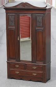 Sold at Auction: OAK CARVED ARMOIRE